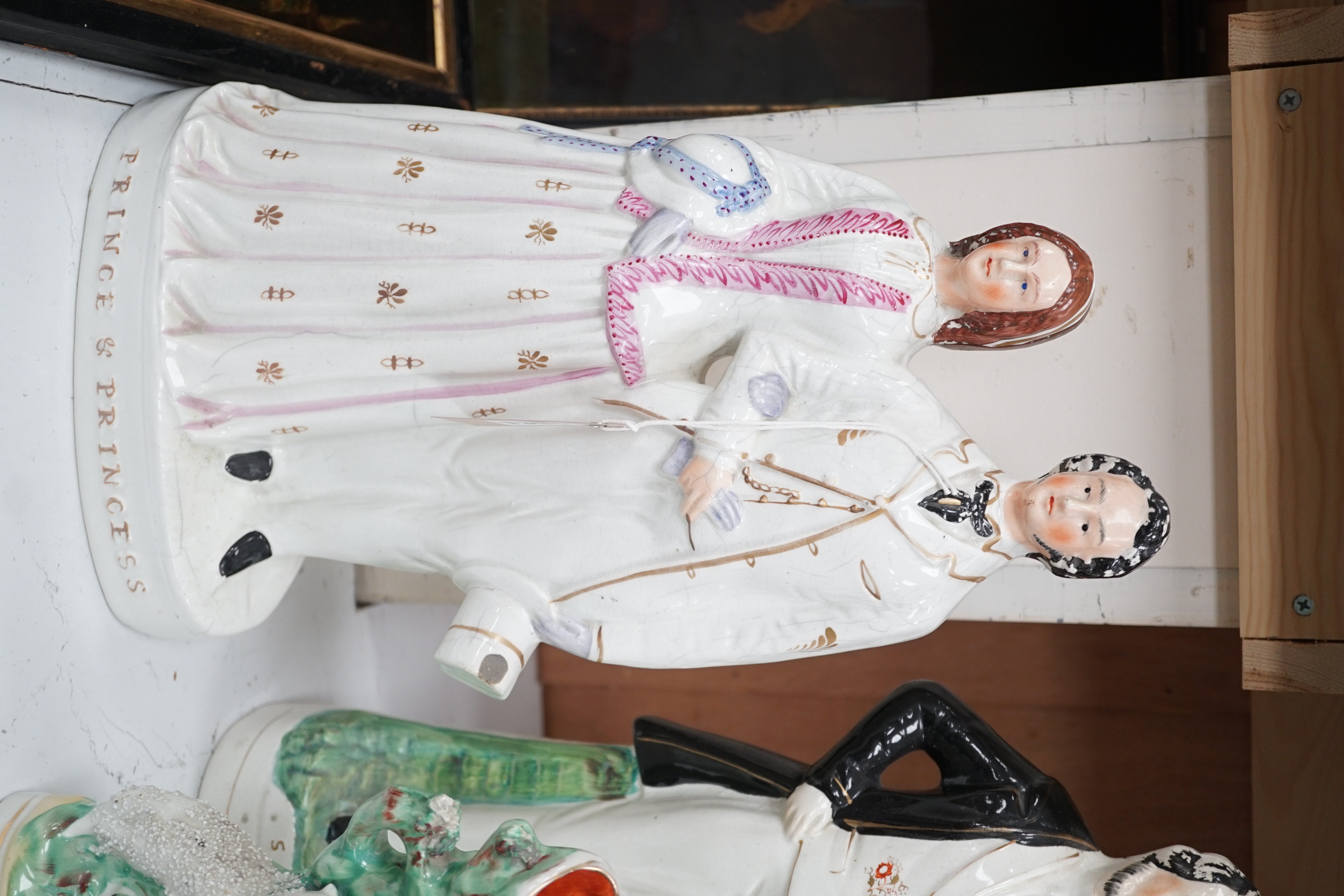 A collection of mostly 19th century Staffordshire flatbacks, including Princess Royal and Frederick of Prussia, Queen Victoria, Sankey and Moody, Prince and Princess etc. tallest Sir Charles Napier, 42cms high
